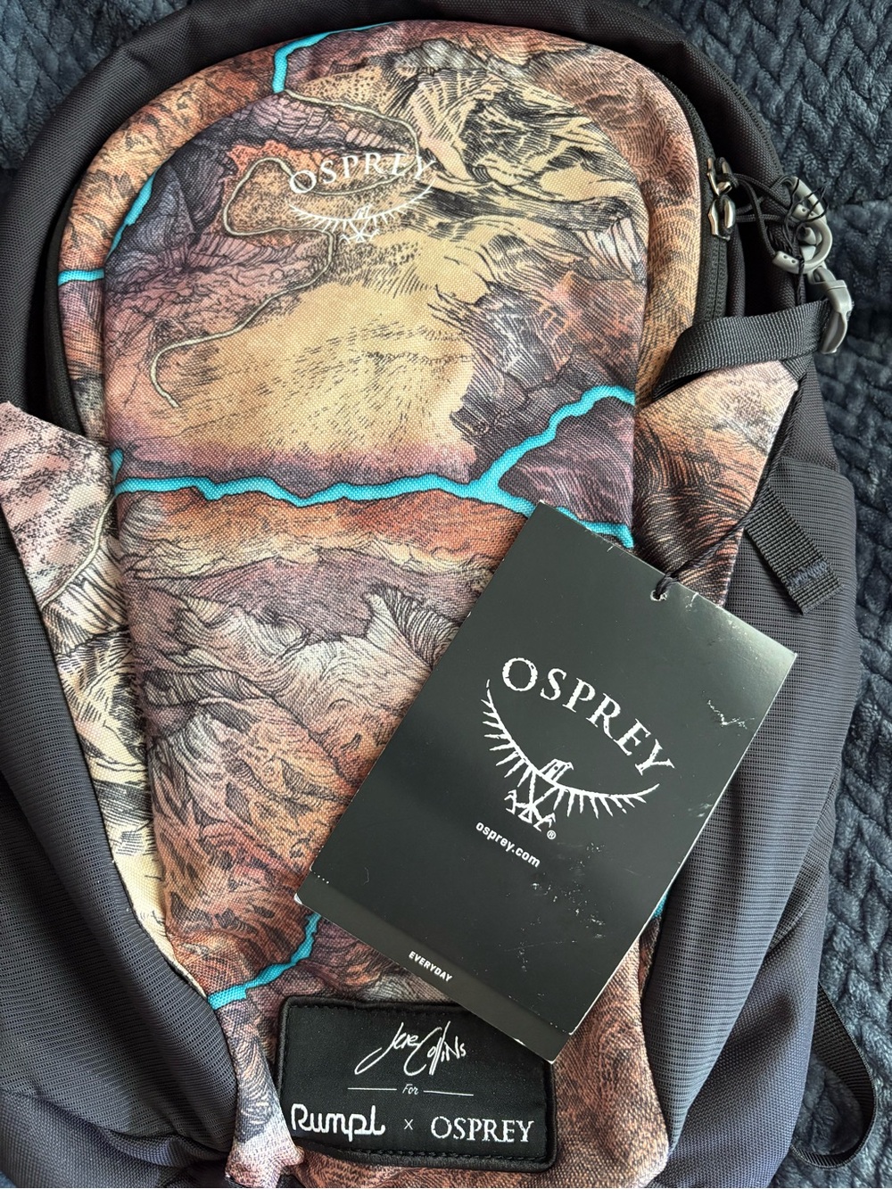 OSPREY Black Backpack with Earth-Tone Pattern and Turquoise Accents - Picture 2 of 4